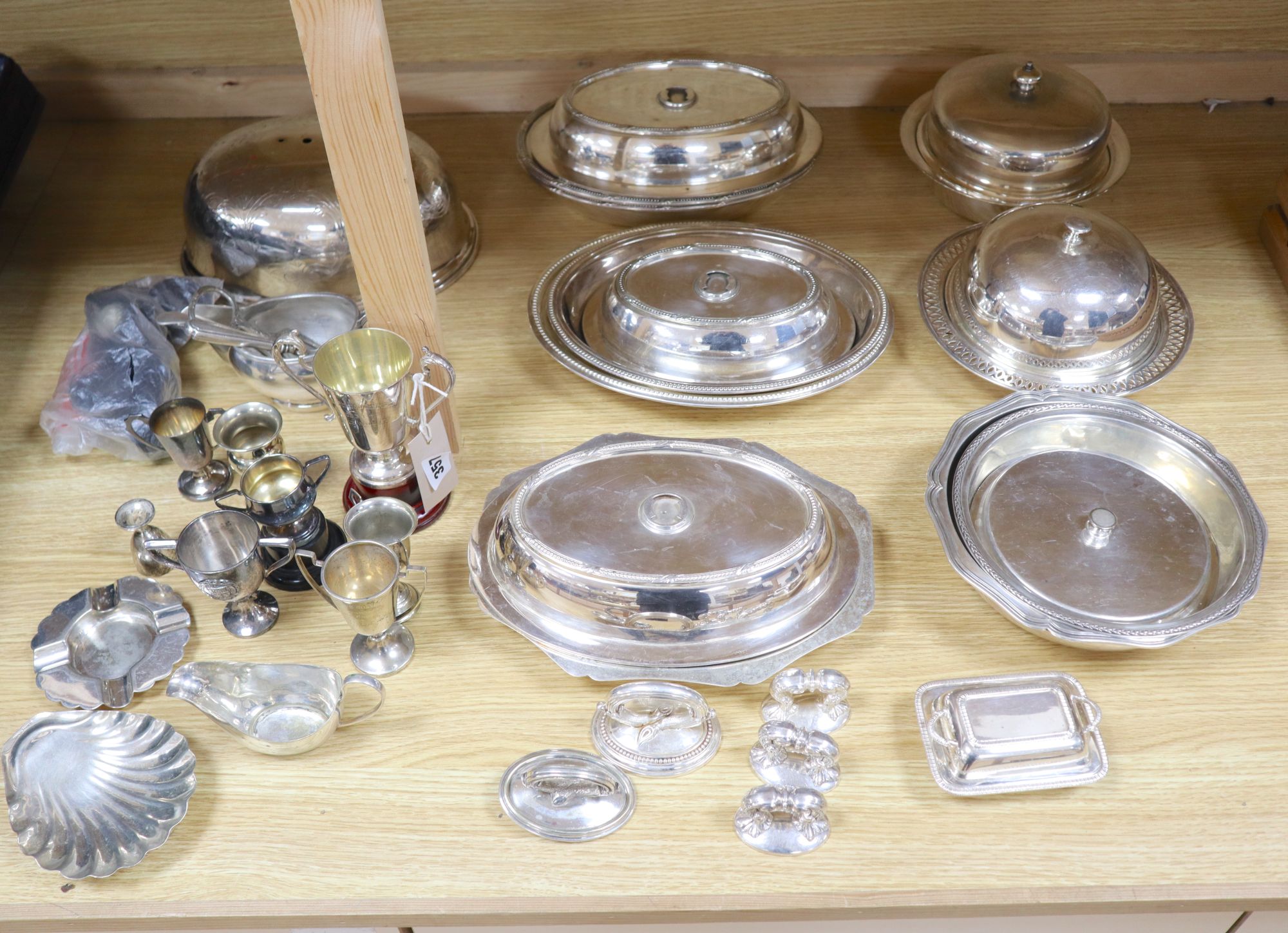 A quantity of plated items, including entree dishes and covers,